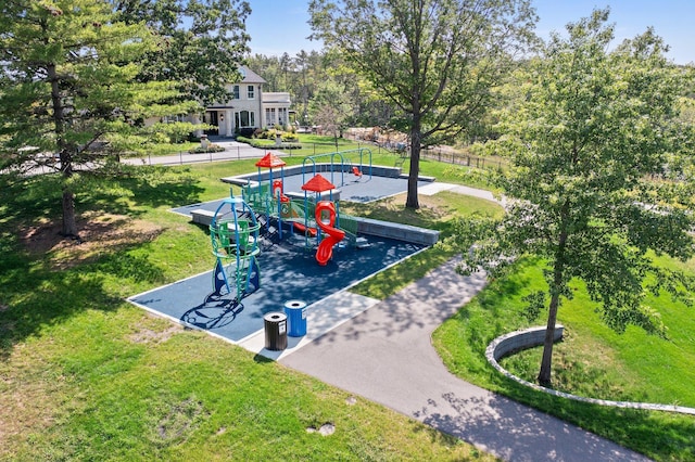 exterior space featuring a playground and a yard