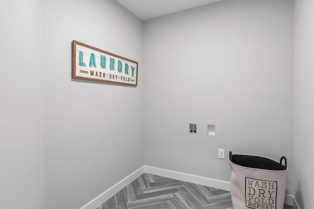 laundry area with washer hookup and parquet flooring