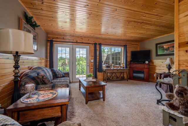 carpeted living room with wooden ceiling