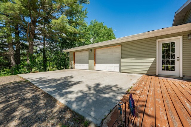 exterior space featuring a garage and an outdoor structure