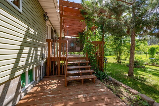 wooden terrace with a lawn