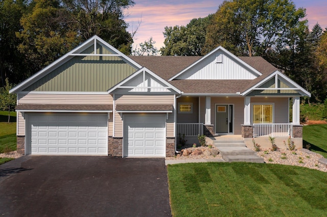 craftsman house featuring a lawn and covered porch