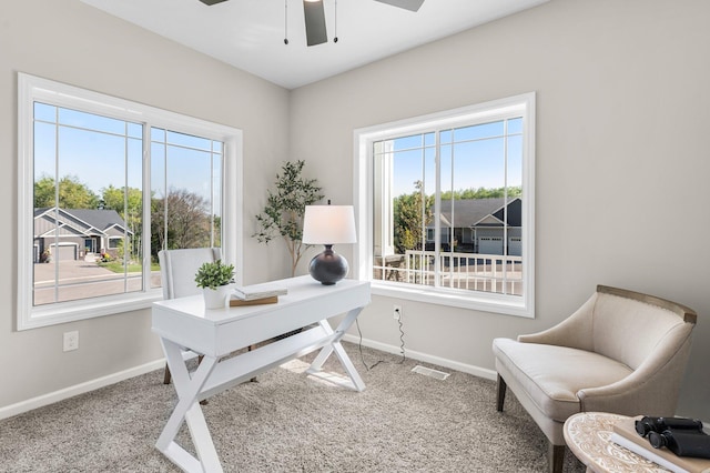 carpeted office with ceiling fan