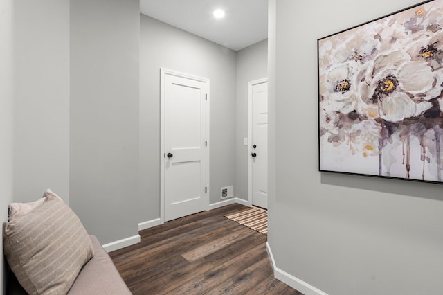 hall with dark wood-type flooring