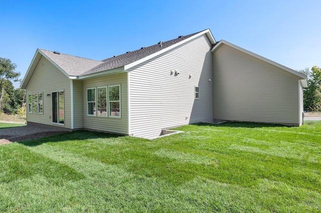 view of property exterior featuring a lawn