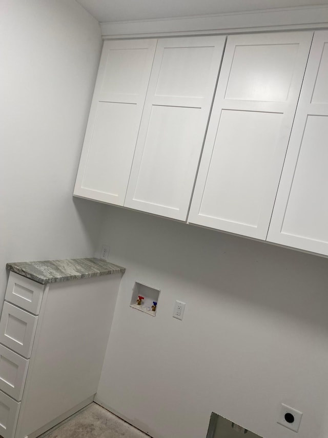 laundry area with cabinet space, hookup for an electric dryer, and hookup for a washing machine