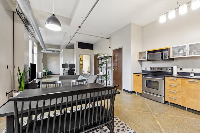 kitchen featuring hanging light fixtures and electric range