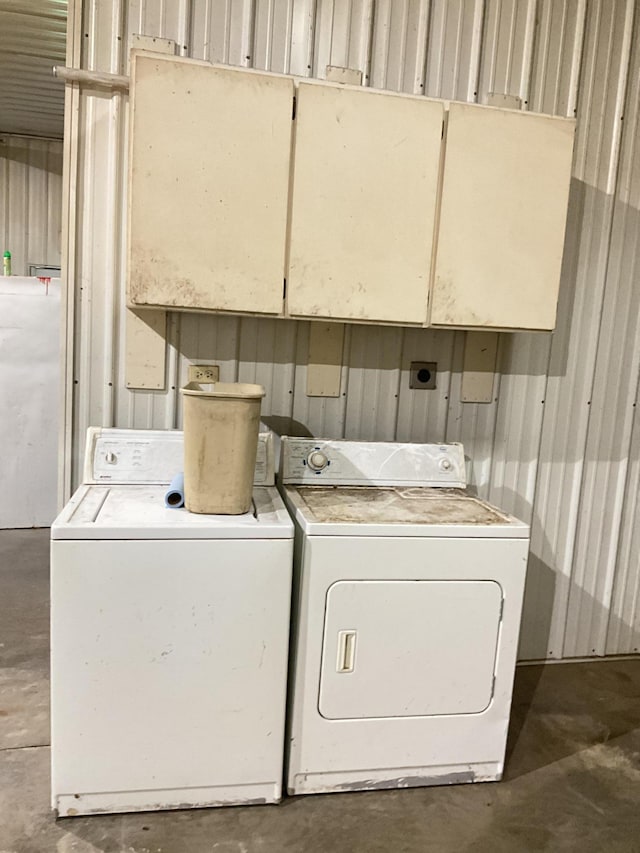 laundry room with separate washer and dryer