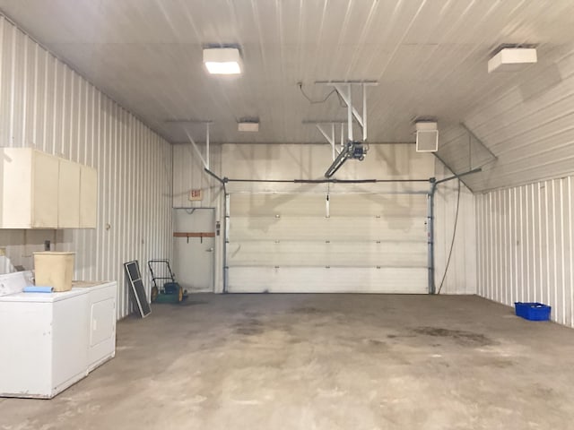 garage featuring washer / clothes dryer and a garage door opener