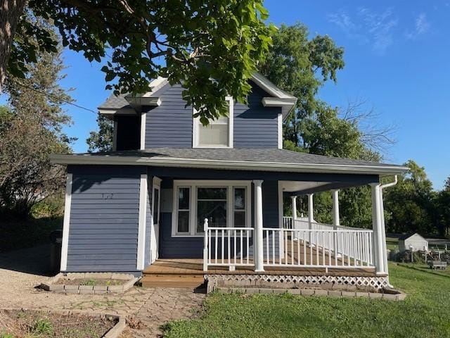 view of front of home featuring a porch and a front yard