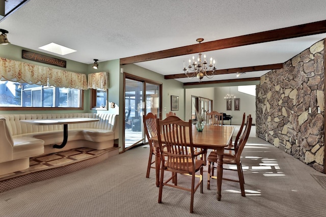 10834 178th Cir NW, Elk River, MN 55330 - carpeted dining area with a chandelier, healthy amount of natural light, a textured ceiling, beamed ceiling, and a skylight