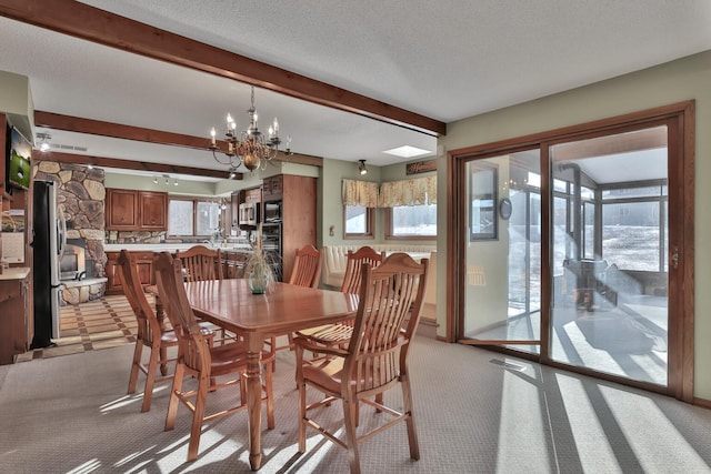 10834 178th Cir NW, Elk River, MN 55330 - dining space with light carpet, beamed ceiling, a chandelier, and a textured ceiling