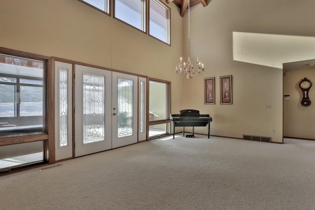 10834 178th Cir NW, Elk River, MN 55330 - entrance foyer featuring a towering ceiling, carpet, a chandelier, french doors, and baseboards