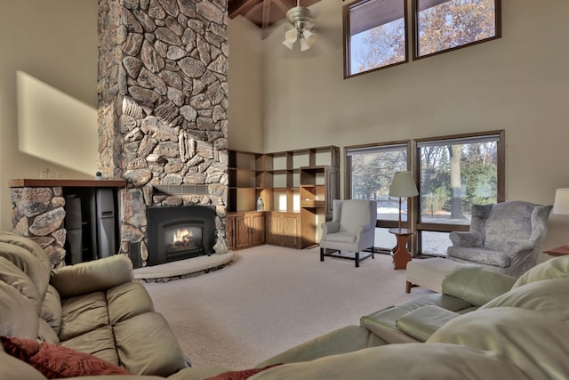 10834 178th Cir NW, Elk River, MN 55330 - living room with a high ceiling, carpet flooring, a fireplace, ceiling fan, and beam ceiling