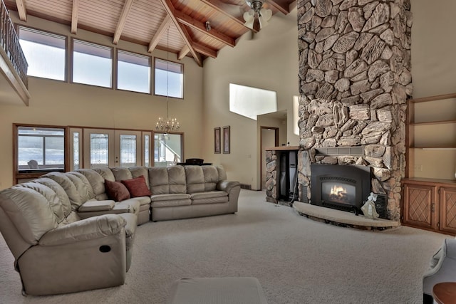 10834 178th Cir NW, Elk River, MN 55330 - carpeted living area with wooden ceiling with exposed beams, a fireplace, a towering ceiling, healthy amount of natural light, and a chandelier