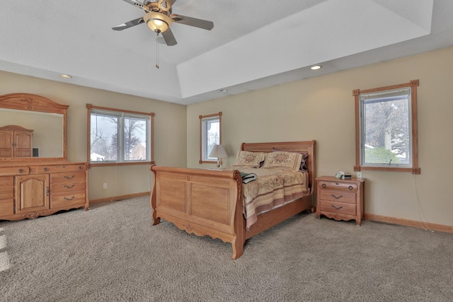 10834 178th Cir NW, Elk River, MN 55330 - bedroom with light carpet, baseboards, a raised ceiling, a ceiling fan, and recessed lighting