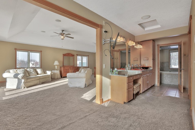 10834 178th Cir NW, Elk River, MN 55330 - bathroom featuring a ceiling fan, vanity, tile patterned flooring, and baseboards