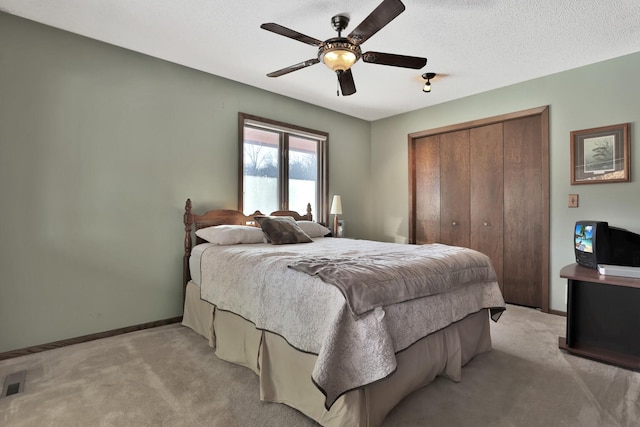 10834 178th Cir NW, Elk River, MN 55330 - bedroom featuring light colored carpet, a closet, baseboards, and ceiling fan