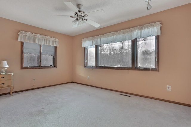 10834 178th Cir NW, Elk River, MN 55330 - carpeted empty room featuring baseboards and a ceiling fan