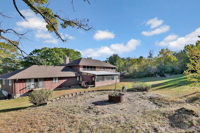 10834 178th Cir NW, Elk River, MN 55330 - rear view of property featuring a chimney, a yard, and board and batten siding