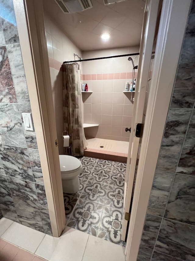 10834 178th Cir NW, Elk River, MN 55330 - full bath featuring toilet, a shower stall, and tile patterned flooring