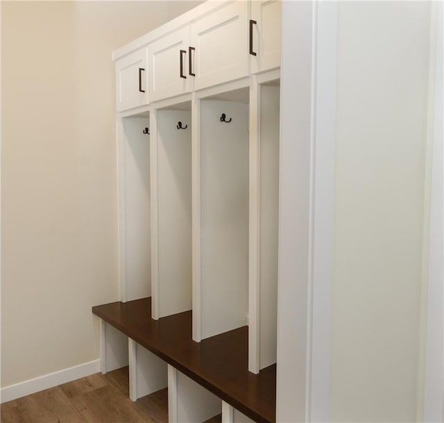 mudroom with light hardwood / wood-style floors