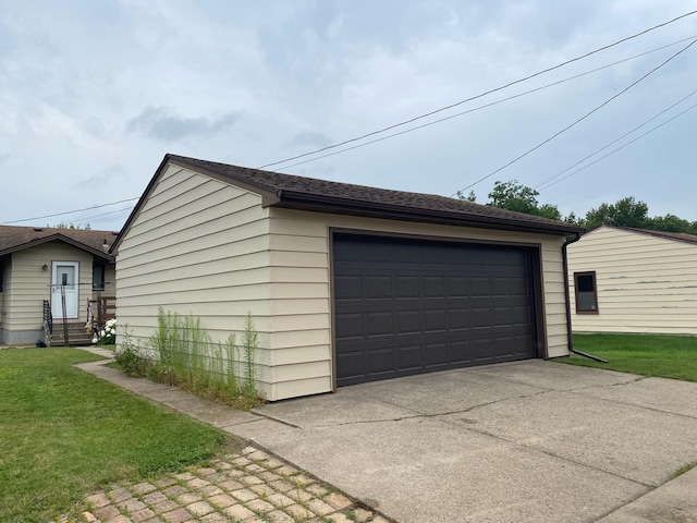 garage featuring a yard