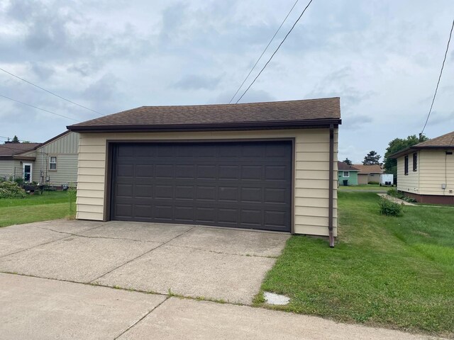 garage with a lawn