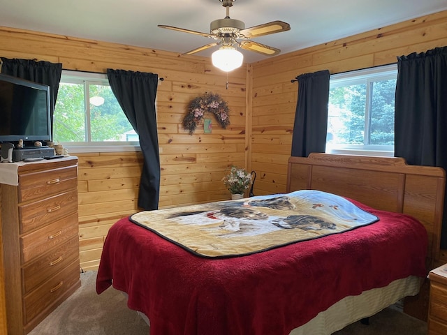 bedroom featuring carpet floors, multiple windows, and ceiling fan