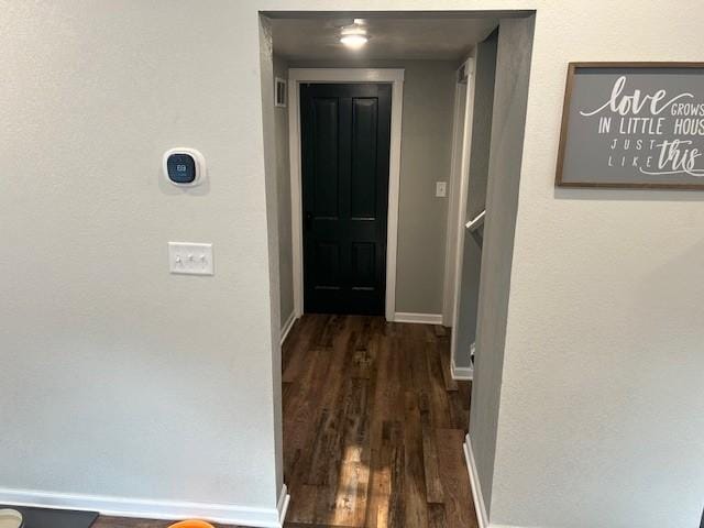 hall featuring dark wood-type flooring