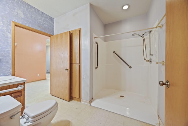 full bathroom featuring vanity, toilet, and a shower