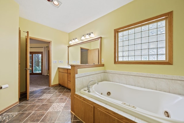 bathroom featuring a bath and vanity