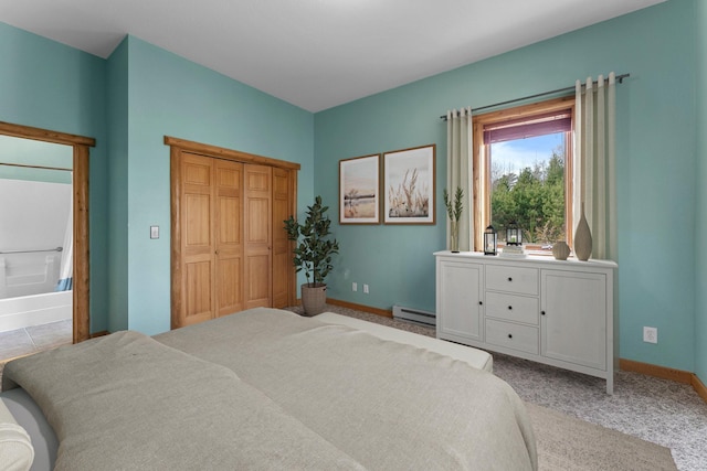 bedroom featuring a baseboard radiator, light colored carpet, and a closet