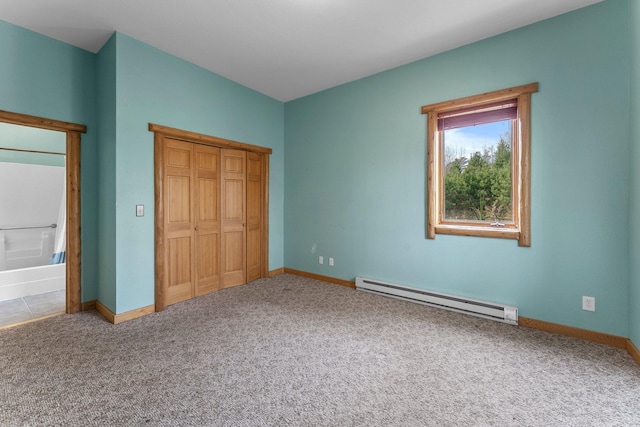 unfurnished bedroom with a closet, carpet flooring, and a baseboard radiator