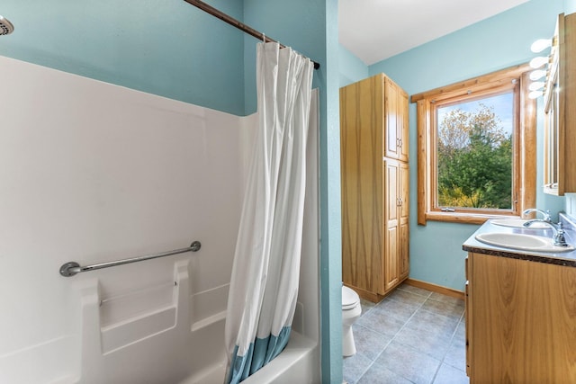 full bathroom featuring toilet, vanity, tile patterned floors, and shower / tub combo with curtain