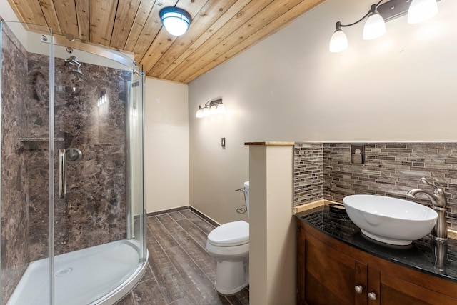 bathroom with toilet, vanity, an enclosed shower, and wooden ceiling