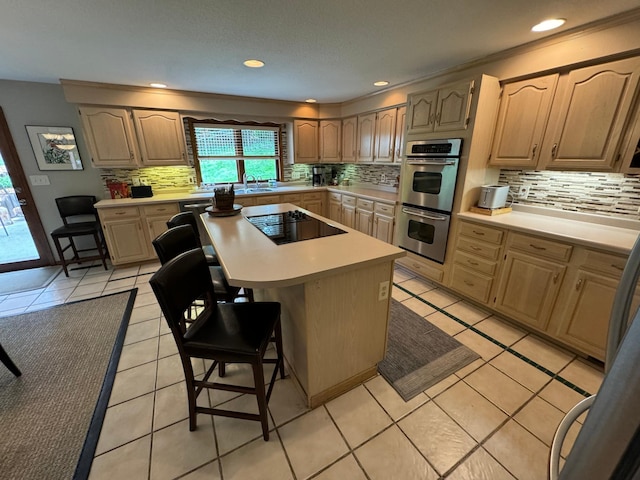 kitchen with decorative backsplash, light tile patterned flooring, and black electric stovetop