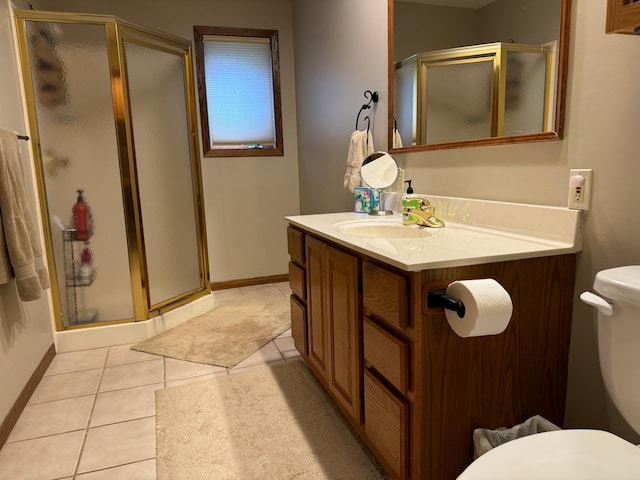 bathroom featuring vanity, an enclosed shower, tile patterned flooring, and toilet