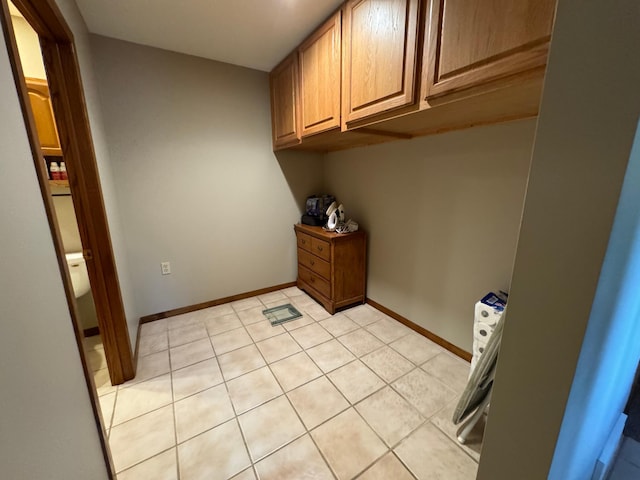 laundry room with light tile patterned flooring