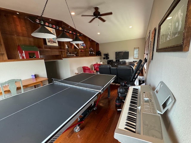 rec room with dark hardwood / wood-style floors and ceiling fan