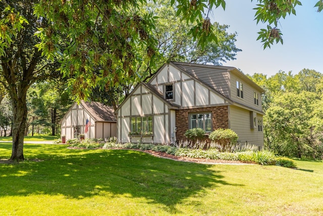 rear view of property with a lawn