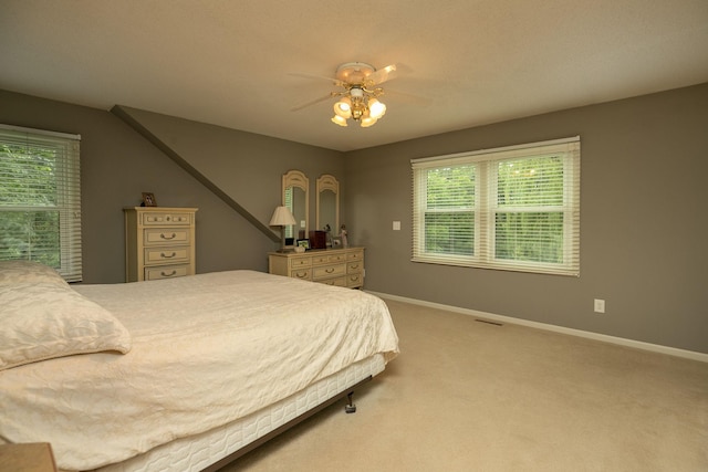 bedroom with ceiling fan and carpet