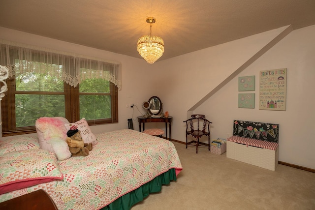 carpeted bedroom with a notable chandelier