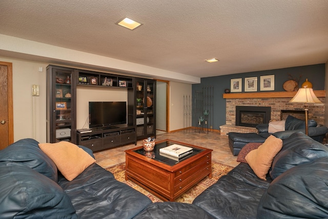 living room with a fireplace and a textured ceiling