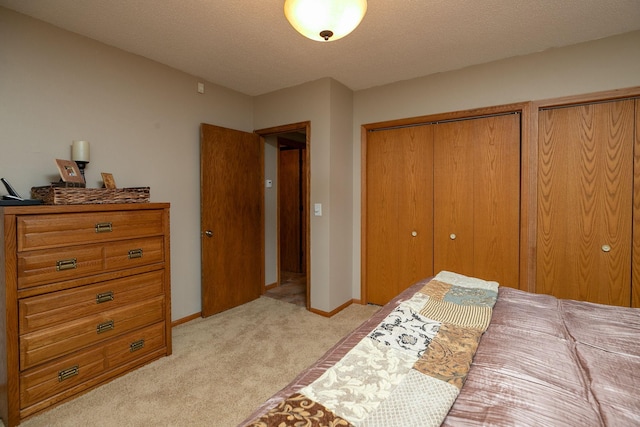 carpeted bedroom featuring a textured ceiling