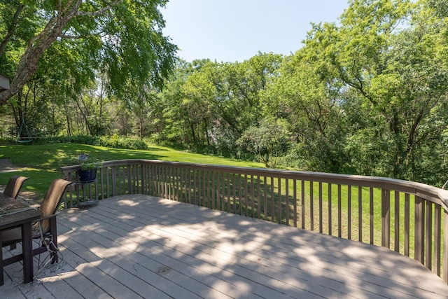 wooden terrace with a yard