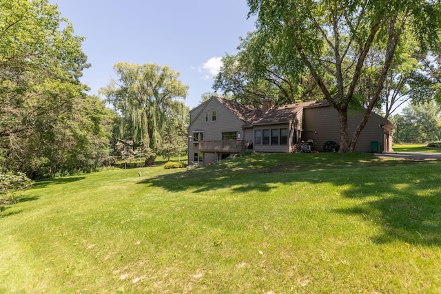 view of yard with a wooden deck