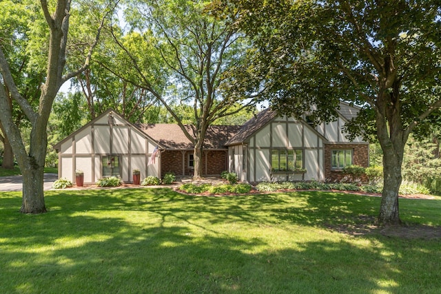 tudor house with glass enclosure and a front yard