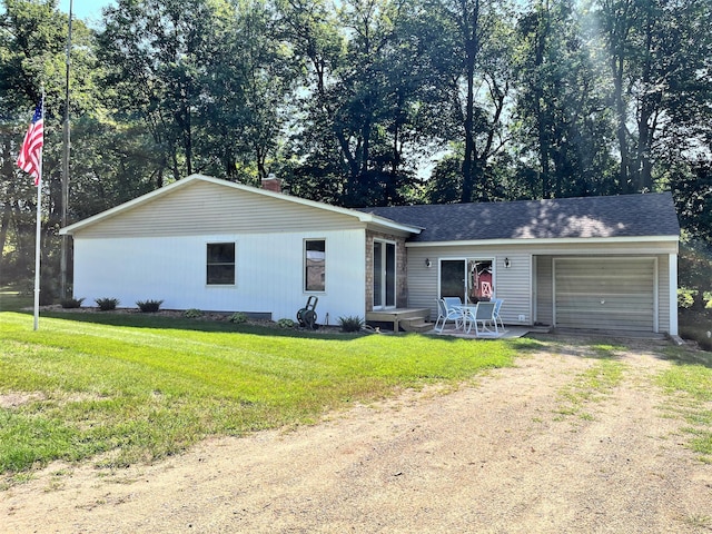 single story home with a front lawn and a garage