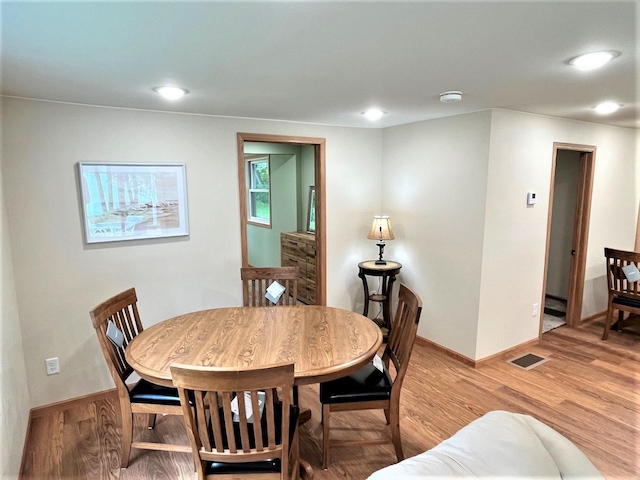 dining space featuring hardwood / wood-style floors